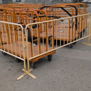 Metal crowd control stanchions. Features tubular metal construction, vertical pickets, interlocking connector hooks, and flat support feet. 101"L each