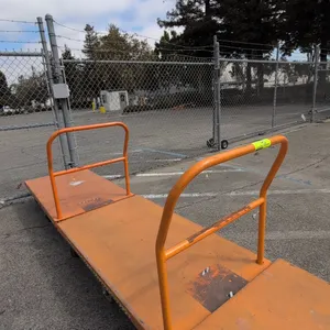 Metal platform carts. Features steel construction with orange finish, tubular push handle, and 6-wheel caster configuration. Dimensions: 54" x 30".