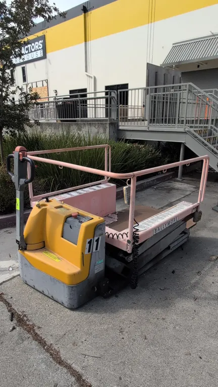 2018 Ballymore PLDE15 portable loading dock scissor lift. Features 1,500 lb rated capacity, safety handrails, tethered push-button pendant control, ti