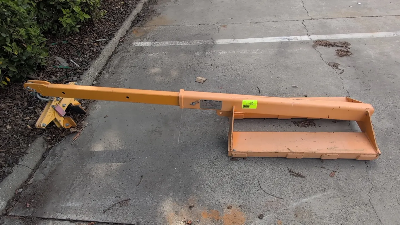 2018 Abaco AFJ25 forklift boom. Features telescoping reach with pin-locking positions, fork pockets, safety chain, swivel shackle, and attached slab l