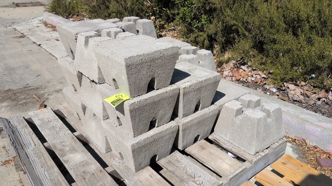 Concrete pier blocks. Features pre-cast concrete construction with cross-slotted tops designed for joist and post support. 10½" x 10½" x 7½".