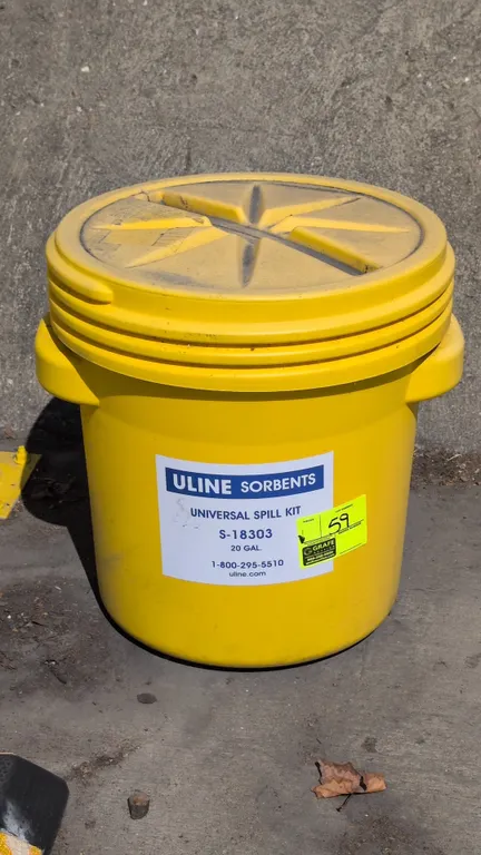 Uline S-18303 20-gallon universal spill kit drum. Features yellow polyethylene construction, screw-top lid, and molded side carry handles.