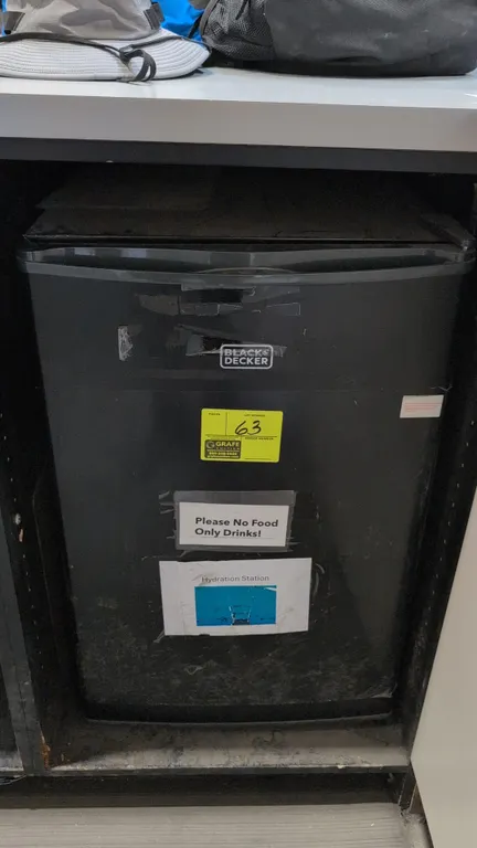 Black+Decker BCRK43 compact refrigerator. Features 4.3 cu. ft. capacity, upper freezer compartment, glass shelving, and door storage bins. S/N: 232500