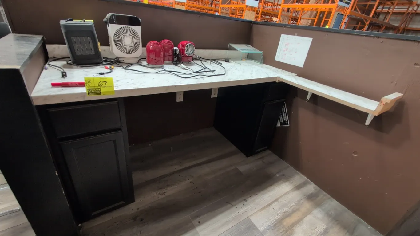 Laminate desk and filing cabinet lot. Includes 64"L desk featuring a faux marble laminate countertop, two black under-counter base cabinets with drawe