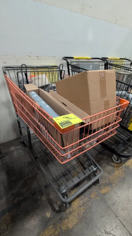 Assorted building supplies with metal shopping cart. Includes electrical and conduit fittings, strut hardware, PEX accessories, sliding rollers, mosai