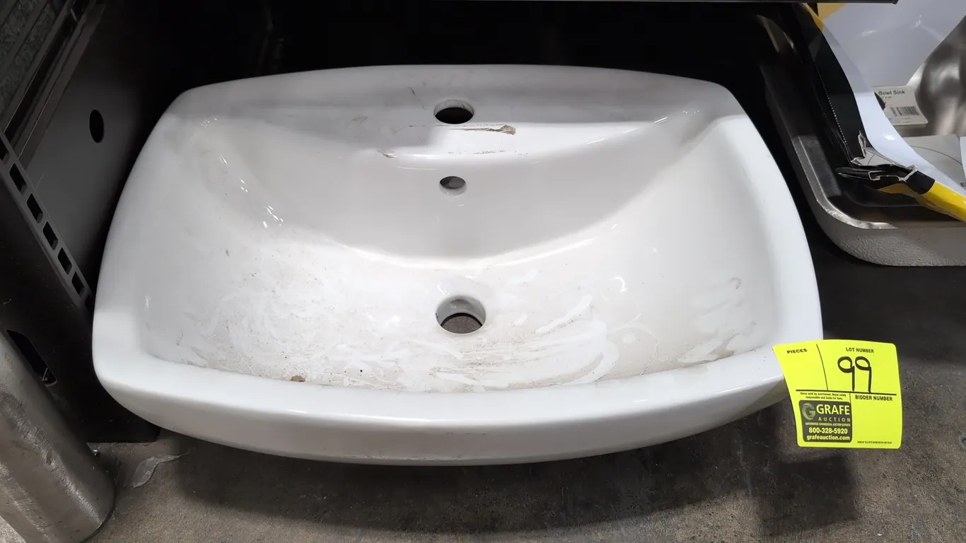 Porcelain bathroom sink. Features white porcelain construction, single faucet hole, and integrated overflow drain. Dimensions: 21½" x 15½" x 7".