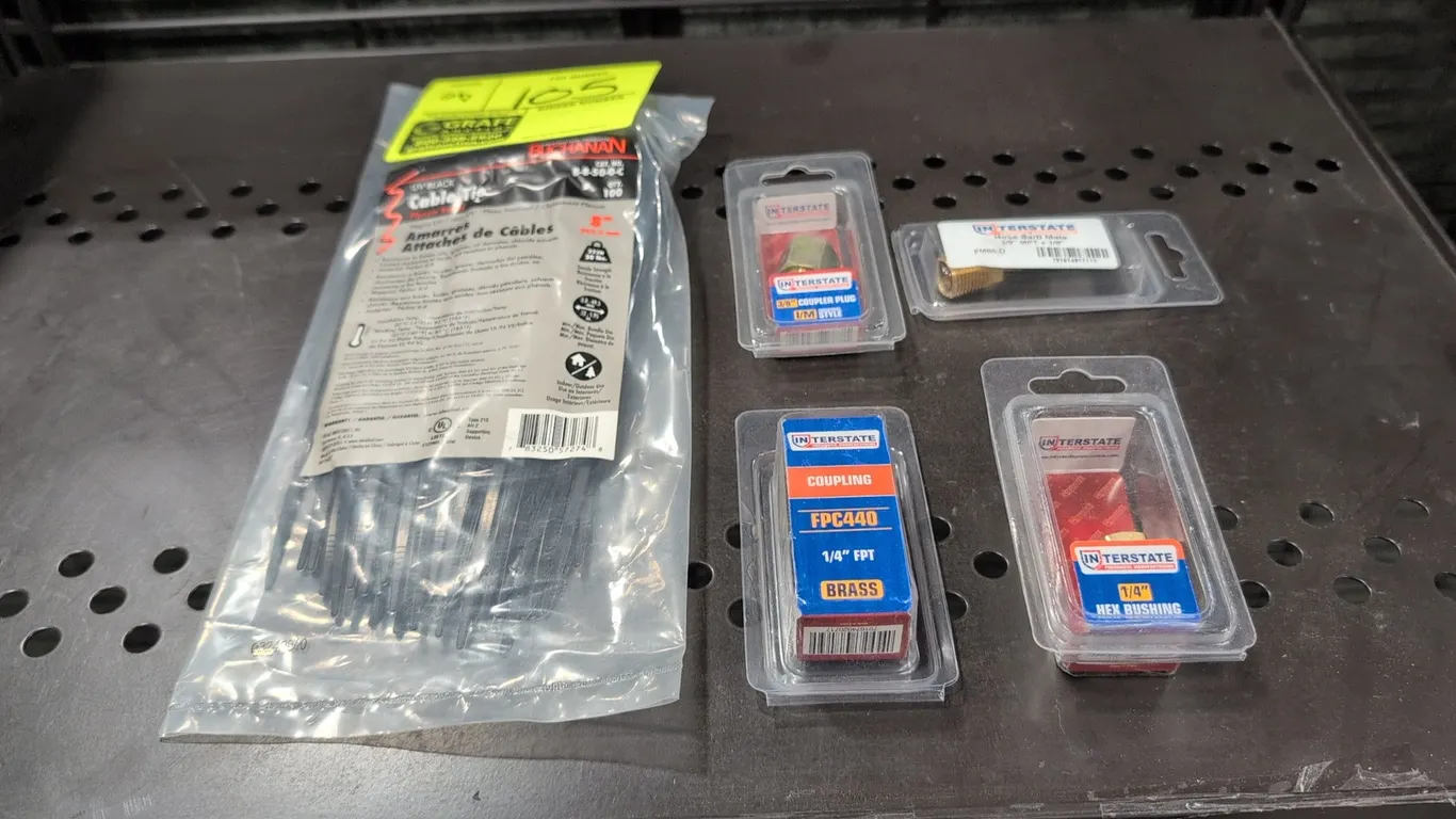 Cable ties and pneumatic hardware assortment. Includes a 100-pack of Buchanan 8" UV black cable ties (B-8-50-0-C) and (4) packaged Interstate Pneumati