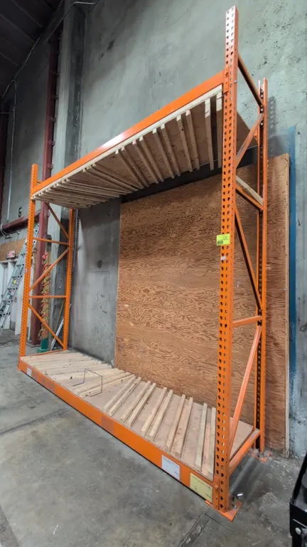 12'L section of HMH teardrop pallet racking. Features 4" crossbars and wood decks with attached wood slat dividers. Upright dimensions: 34"W x 144"H.