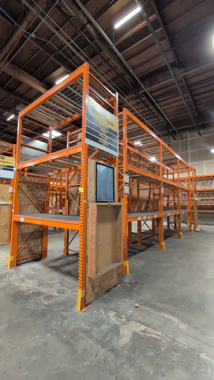 HMH metal teardrop pallet racking sections. Features 5-1/2" crossbars, wire decking, and wood decking. Dimensions: 8'L x 42"W x 168"H.