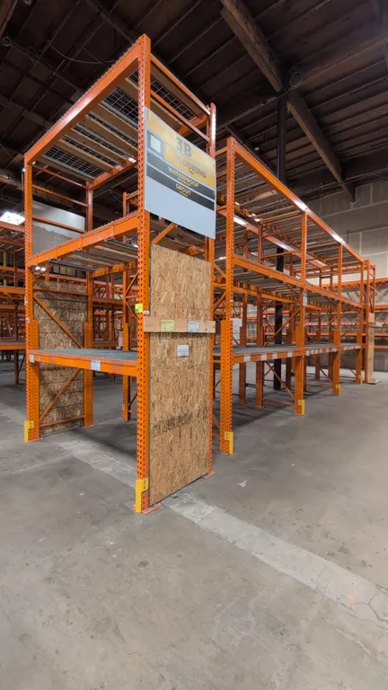 8' sections of HMH teardrop metal pallet racking. Features 5-1/2" crossbars, wire decking, and wood decking. Dimensions: 42"W x 168"H.