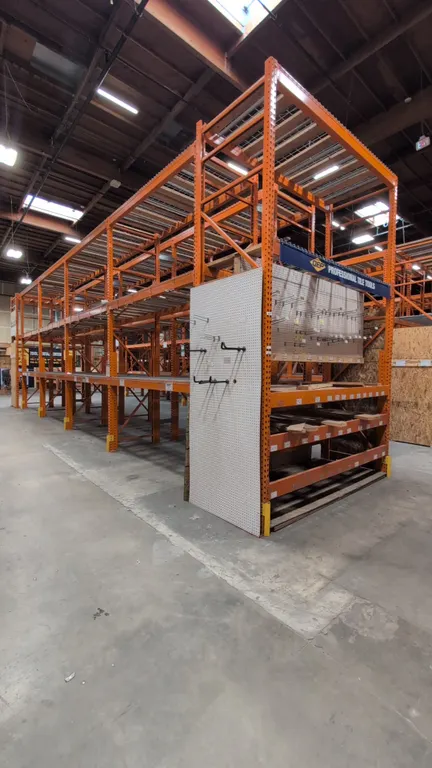 HMH metal teardrop pallet racking sections. Features 5-1/2" crossbars, wire decking, and wood decking. Dimensions: 8'L x 42"W x 168"H each.