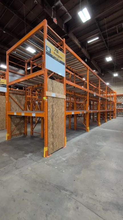 HMH metal teardrop pallet racking sections. Features 5-1/2" crossbars with wood and wire decking. Dimensions: 8'L x 42"W x 168"H.