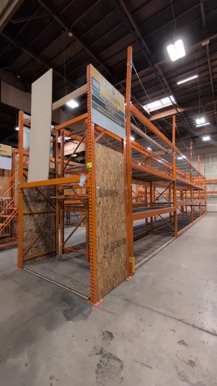 HMH metal teardrop pallet racking. Includes (8) 12'L and (2) 8'L sections. Features 5-1/2" crossbars and wire decking. Uprights measure 42"W x 192"H.