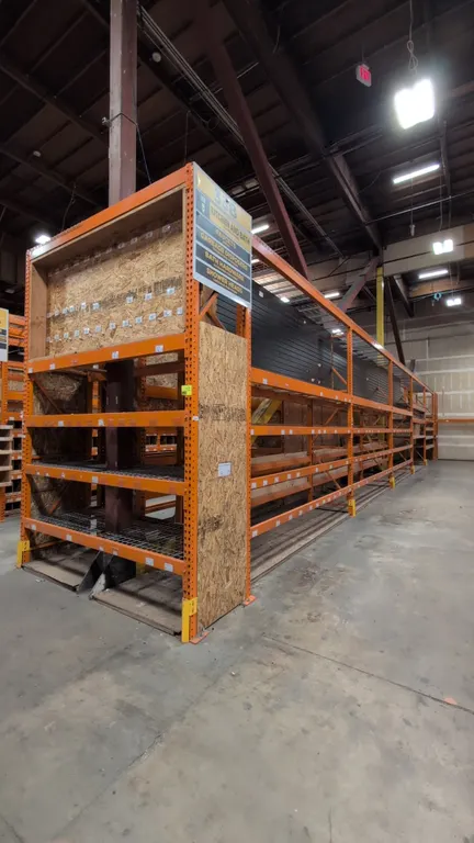 128'L of HMH metal teardrop pallet racking comprising (10) 12' sections and (1) 8' section. Features 5-1/2" crossbars, wood and wire decking, and pegb