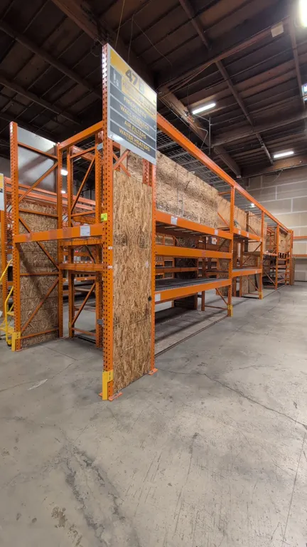 HMH metal teardrop pallet racking. Includes (8) 12' sections and (2) 7.5' sections. Features 4" to 5.5" crossbars, wire mesh decking, and wood decking