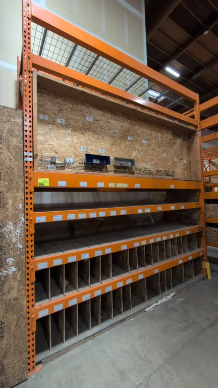 10'L HMH metal teardrop pallet racking section. Features (4) 5-1/2" crossbars, wire mesh top decking, and wood decking with integrated vertical divide