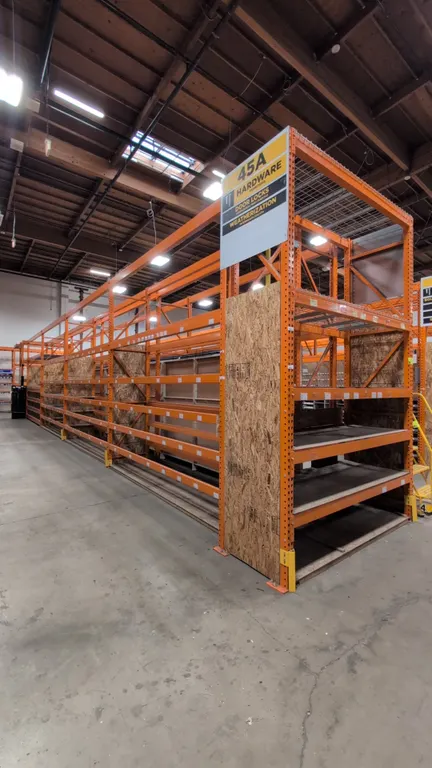HMH metal teardrop pallet racking. Includes (8) 12'L sections and (2) 7-1/2'L sections. Features 4" to 5-1/2" crossbars, wood decking, and wire mesh d