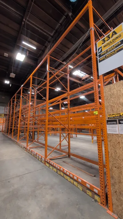 HMH metal teardrop pallet racking 8' sections. Features 4" to 5-1/2" crossbars, wood and wire decks, and vertical wire dividers. Uprights measure 54"W