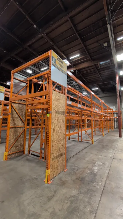 HMH teardrop pallet racking. Includes (8) 12' sections and (2) 7-1/2' sections. Features 5" to 6" crossbars, wire decking, and wood decks. Dimensions:
