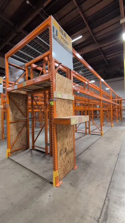 HMH teardrop pallet racking. Includes (8) 12'L sections and (2) 7.5'L sections. Features 4" to 6" crossbars, wire mesh decking, and wood decking. Upri