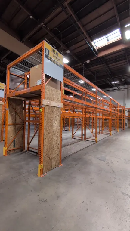 HMH teardrop pallet racking. Includes (8) 12' sections and (2) 7½' sections. Features 4" to 6" crossbars, wood decking, and wire decking. Uprights mea