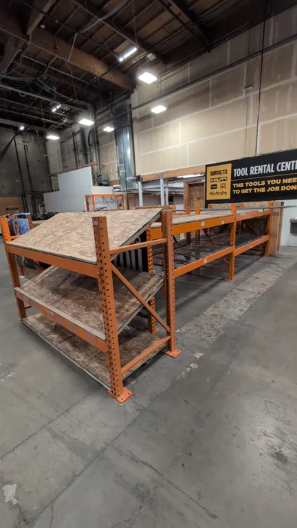 HMH metal teardrop pallet racking. Includes (4) 8' sections and (1) 7.5' section. Features 4" to 5" crossbars, wood and wire decking, and a wood end c