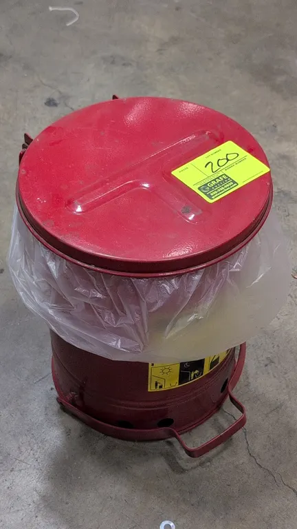 Justrite 09100 oily waste can. 6 gallon nominal capacity. Features foot-operated self-closing lid, carrying handle, and elevated ventilated base. Stee