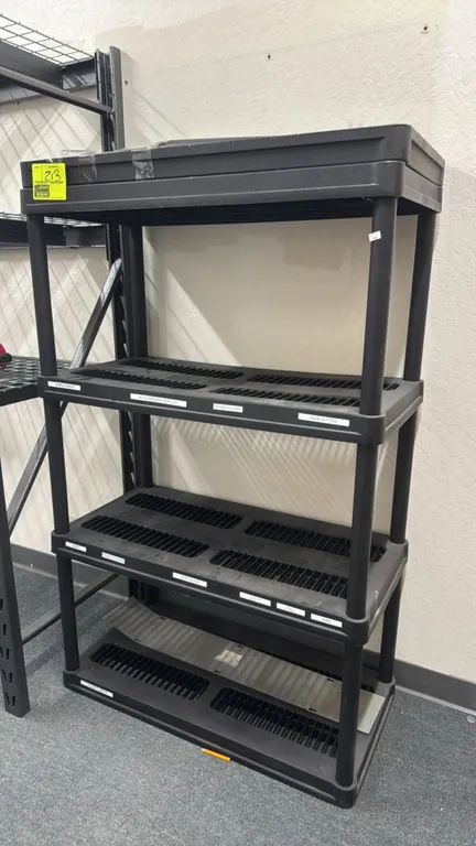 Poly storage shelving rack. Features ventilated shelf design and modular heavy-duty plastic construction. Configured as a 4-tier unit with an addition