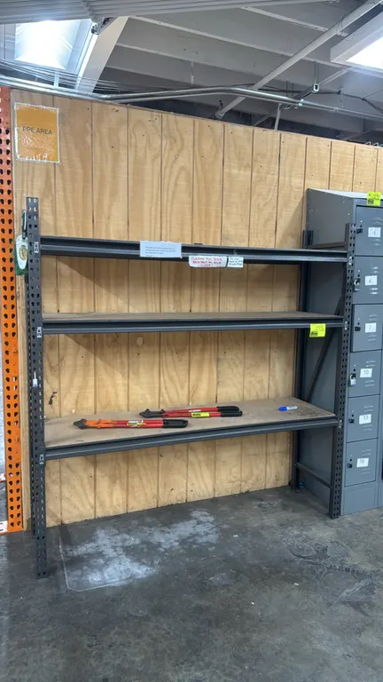 Metal 3-tier storage rack. Features adjustable shelf levels and wood decking. 72" x 18" x 72". Contents and adjacent lockers not included.