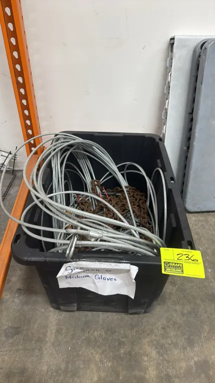 Assorted steel cable and chain with poly storage bin. Includes looped wire rope cables with thimbles, link chain, and padlocks. Contained in a black p