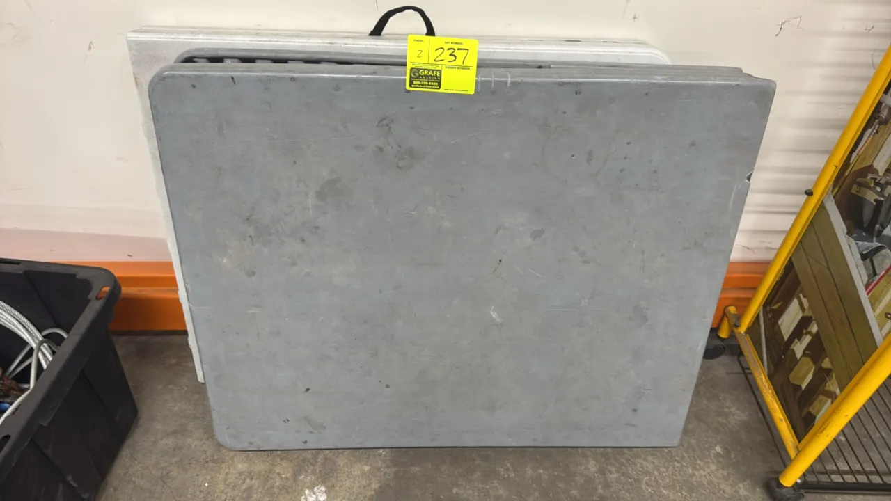 Poly split folding tables. Features fold-in-half plastic tops, integrated carrying handles, and folding metal frames. 72" x 30".