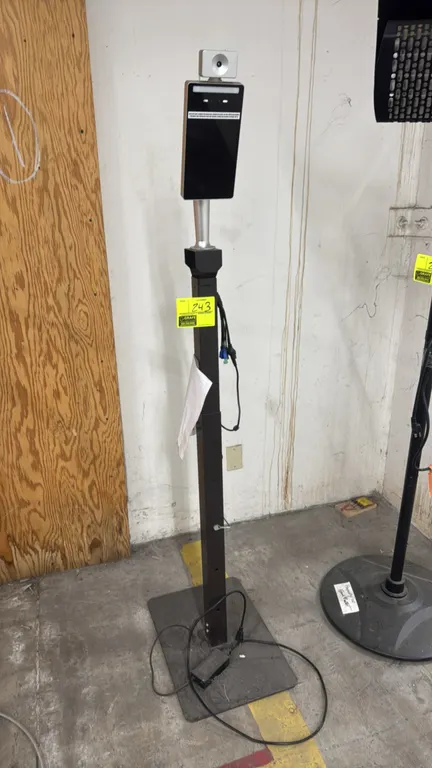 Temperature scan station. Features digital display tablet with integrated facial recognition camera and top-mounted infrared thermal scanner. Mounted