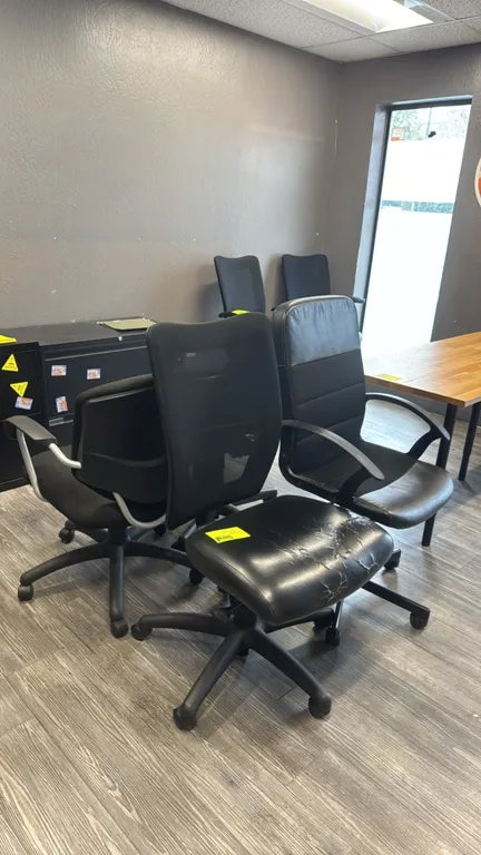 Assorted office chairs. Lot includes mesh-back, faux leather, and fabric upholstered task chairs. Features swivel seats mounted on 5-star bases with r