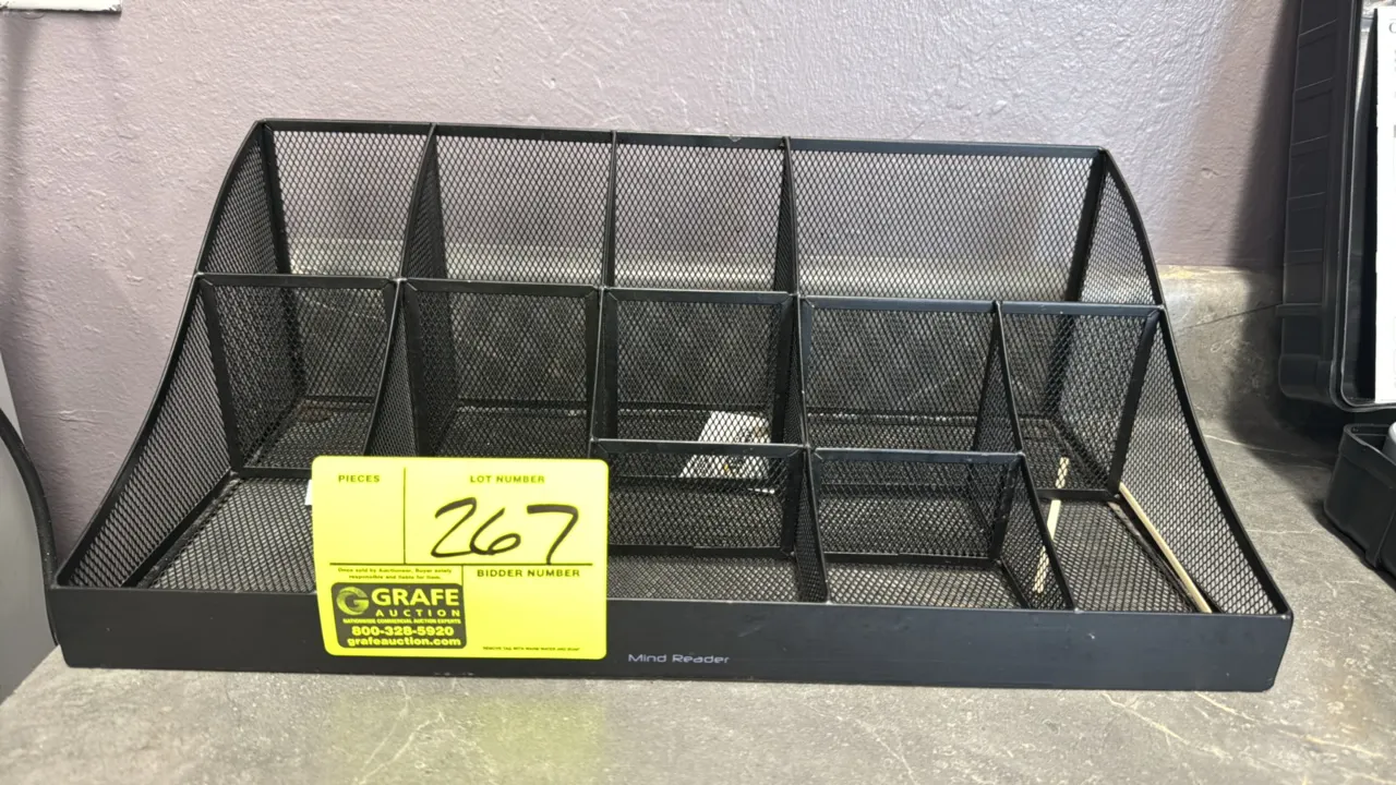Mind Reader metal mesh condiment organizer. Features a multi-compartment tiered construction with black wire mesh design. 18" x 10". Countertop placem