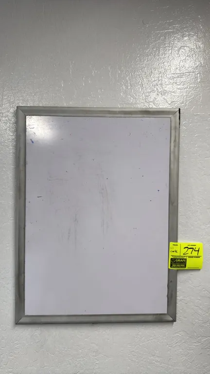 Dry erase whiteboard and cork bulletin board lot. Includes an 18" x 24" whiteboard with metal frame and a 6' x 4' cork board with aluminum frame. Wall