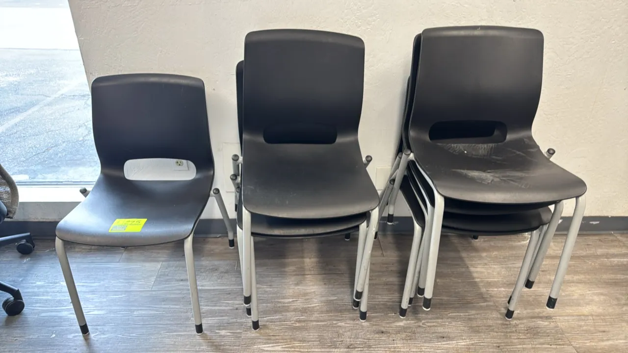HON stackable poly chairs. Features black molded polypropylene seats and backs with lower cutout handle design. Mounted on silver-tone tubular 4-leg m