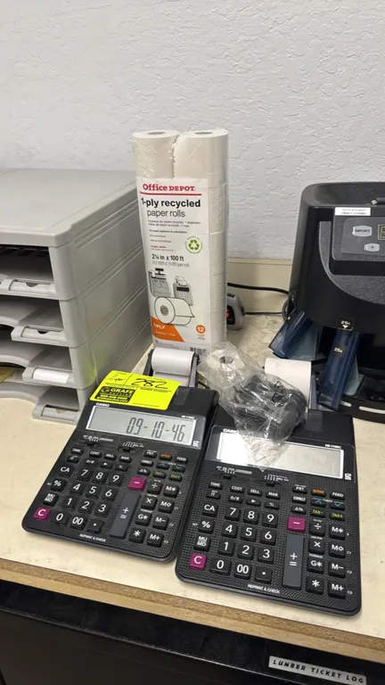 Casio HR-170RC electronic printing calculators. Features 12-digit LCD displays, two-color printing, and check and correct functions. Includes power ad