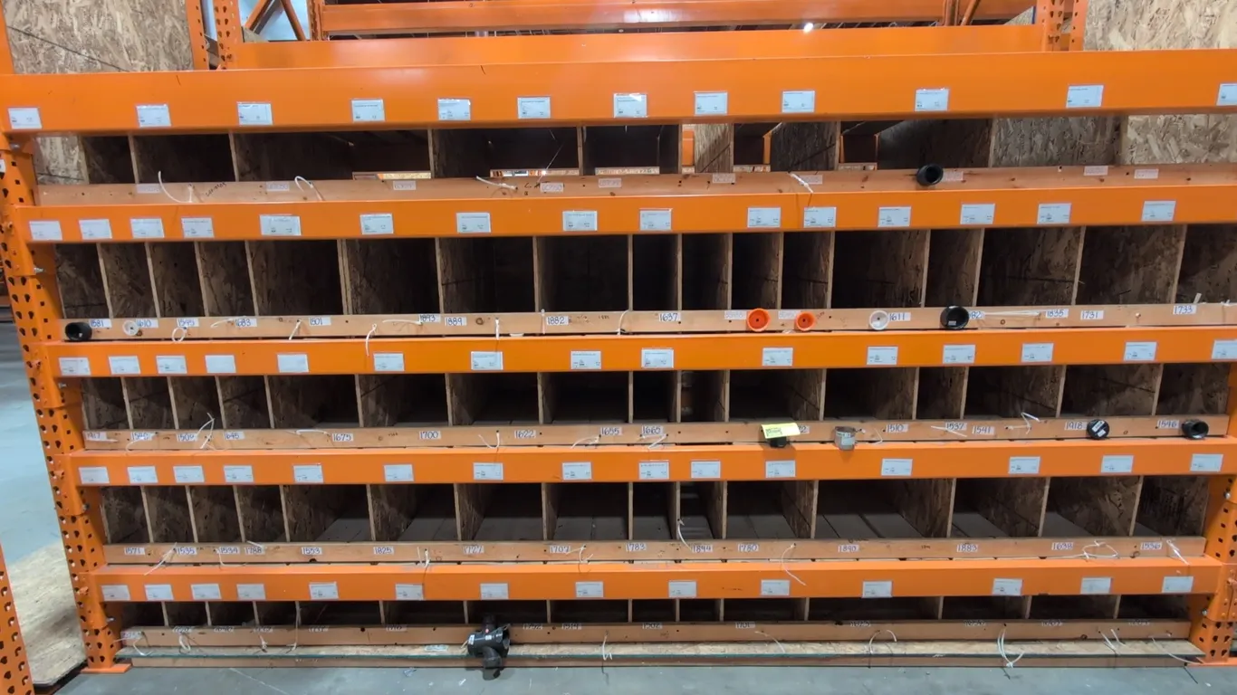 Assorted building supplies. Includes plumbing fittings, ABS pipe couplings, adapters, brass valves, metal electrical junction boxes, covers, and hardw
