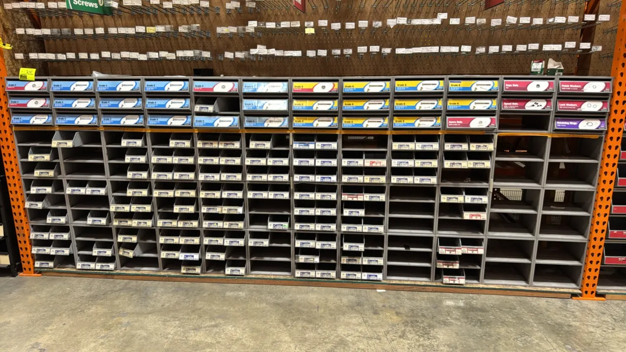 Hillman metal hardware merchandisers. Features multi-compartment open bins and slide-out drawer units. Gray painted finish. 12" x 16" x 52". Contents