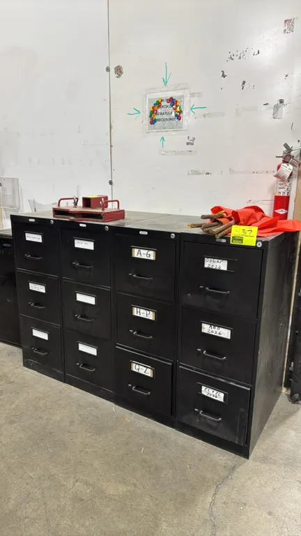 Uline metal file cabinets. Includes (4) 3-drawer vertical file cabinets and (1) 2-drawer vertical file cabinet. Features black metal construction, dra