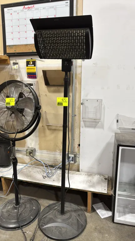 Warm Living WL-SPH15NR electric patio heater. Features an adjustable height pole, digital control panel with push buttons, top heat deflector shield,