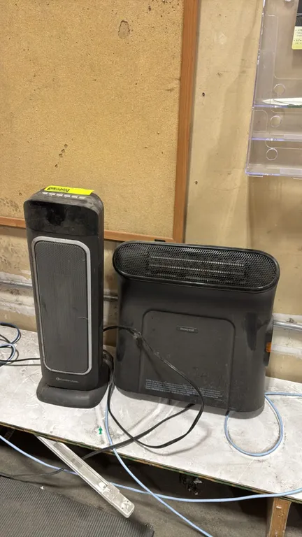 Honeywell and Comfort Zone electric space heaters. Includes (1) Comfort Zone ceramic tower heater with push-button controls and (1) Honeywell compact