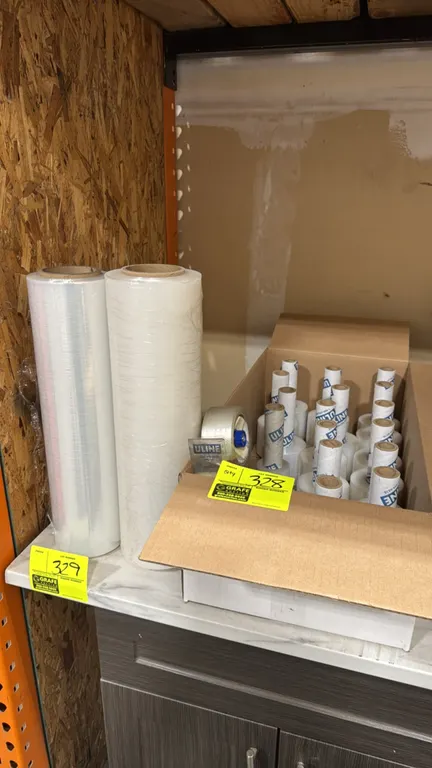 Uline packaging supply package lot. Includes handheld tape dispenser with packing tape and a box of Uline extended core mini stretch wrap rolls. Note: