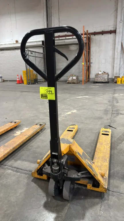Uline standard pallet jack. Features a 5,500 lb load capacity, manual hydraulic pump mechanism with handle-mounted release lever, dual front steer whe