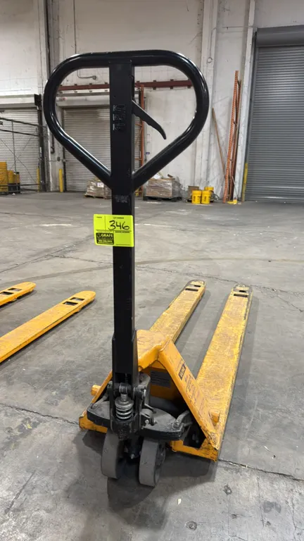 Uline H-2640 long/narrow fork pallet jack. Features a 3,300 lb load capacity, manual hydraulic pump with 3-position loop handle, and dual fork entry r