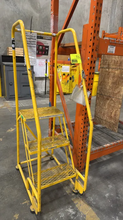 Cotterman 3-step rolling stock ladder. Features expanded metal treads, safety handrails, and a 450 lb max load capacity. Mounted on spring-loaded cast