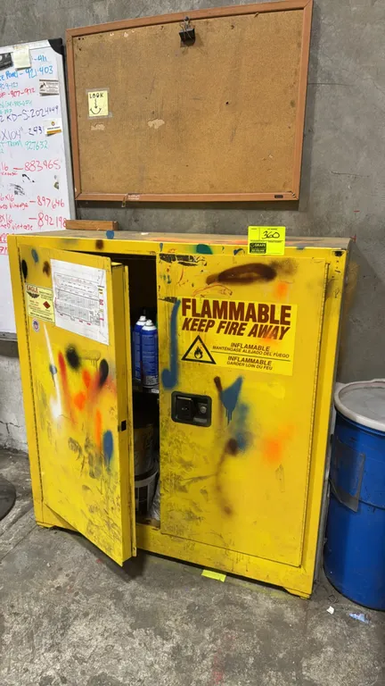 Eagle 3010 flammable safety storage cabinet. Features 30-gallon capacity, double doors, interior shelf, and FM approval. Meets OSHA and NFPA Code 30 s
