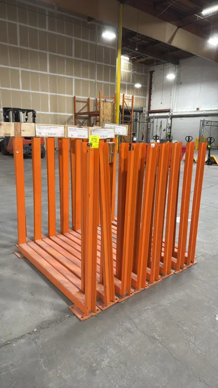 Metal storage stands. Welded steel U-frame construction with orange finish. Features pre-drilled base plates for floor anchoring. Dimensions: 56" x 48