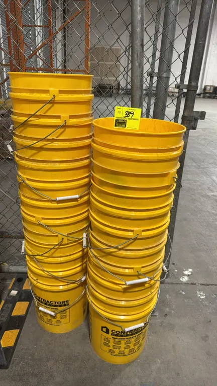 Contractors Warehouse 5-gallon poly buckets. Yellow plastic construction with metal wire bail handles and plastic grips.
