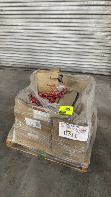 Milwaukee retail display racks and hooks. Pallet lot includes assorted red metal display hooks, brackets, and saw blade merchandiser hangers. Unit is